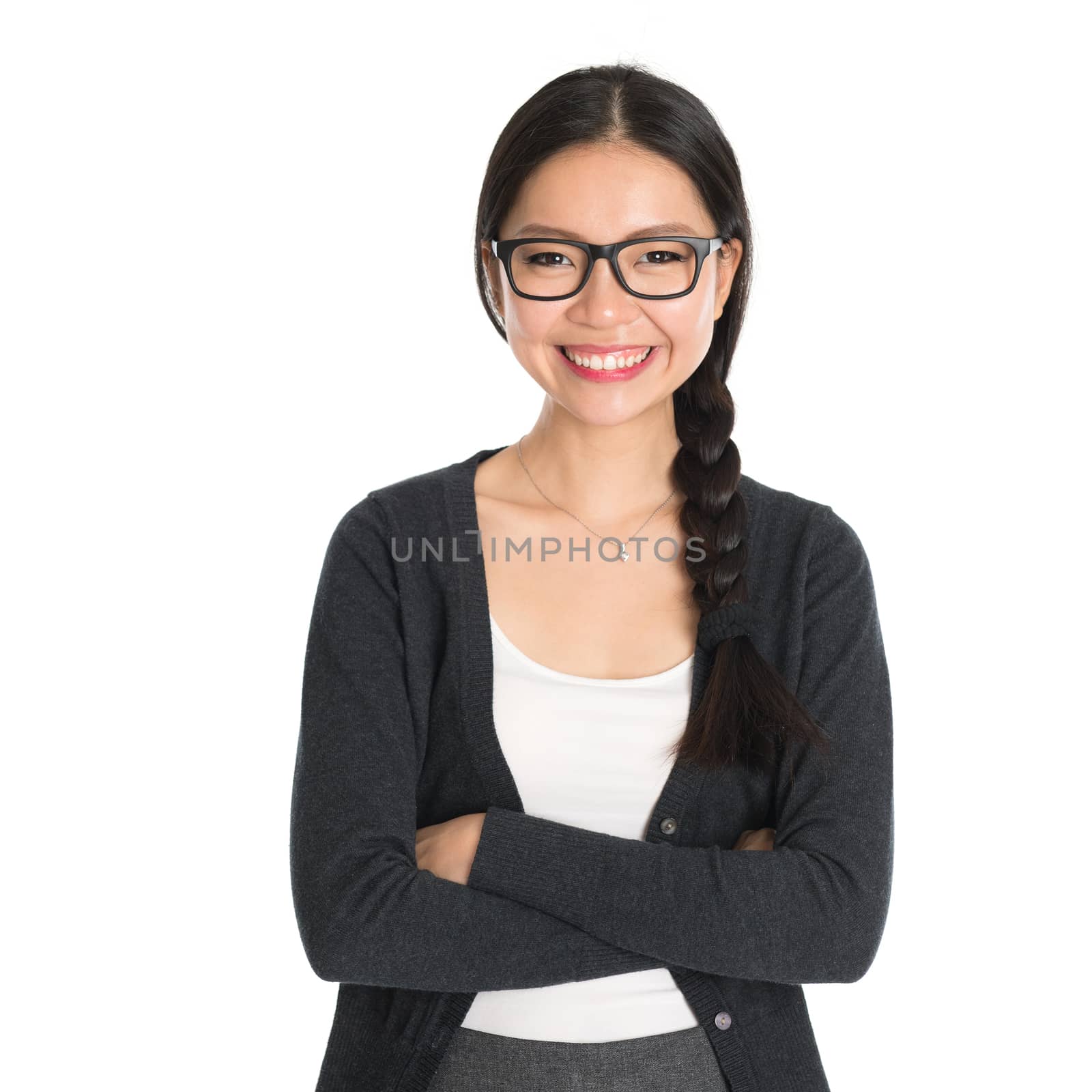 Portrait of Asian young female business executive standing isolated on white background.