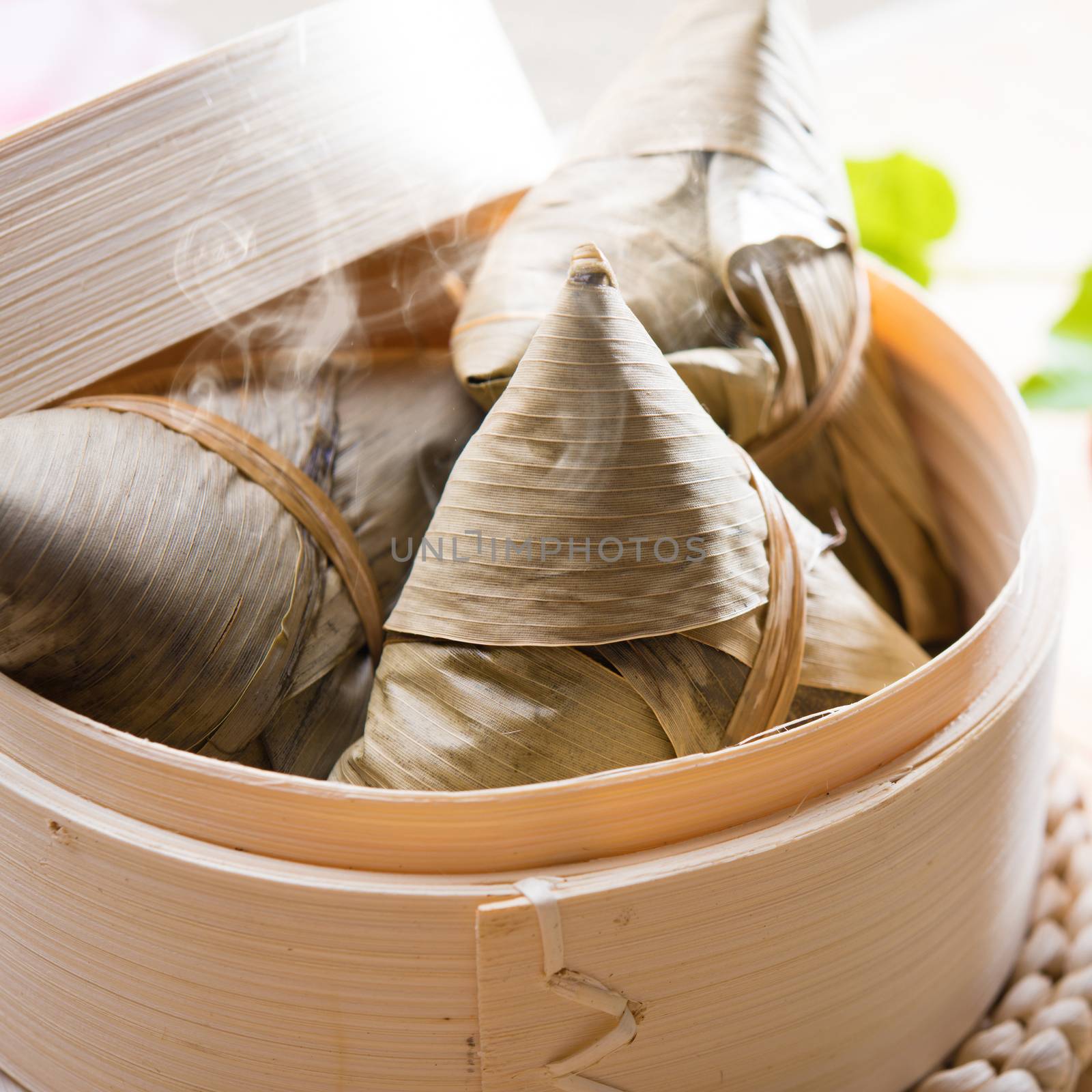 Hot rice dumpling or zongzi. Traditional steamed sticky glutinous rice dumplings. Chinese food dim sum. Asian cuisine.