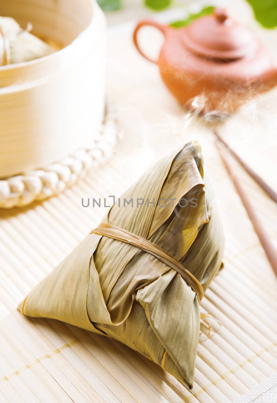 Zongzi or rice dumpling. Traditional steamed sticky glutinous rice dumplings. Chinese food dim sum. Asian cuisine.