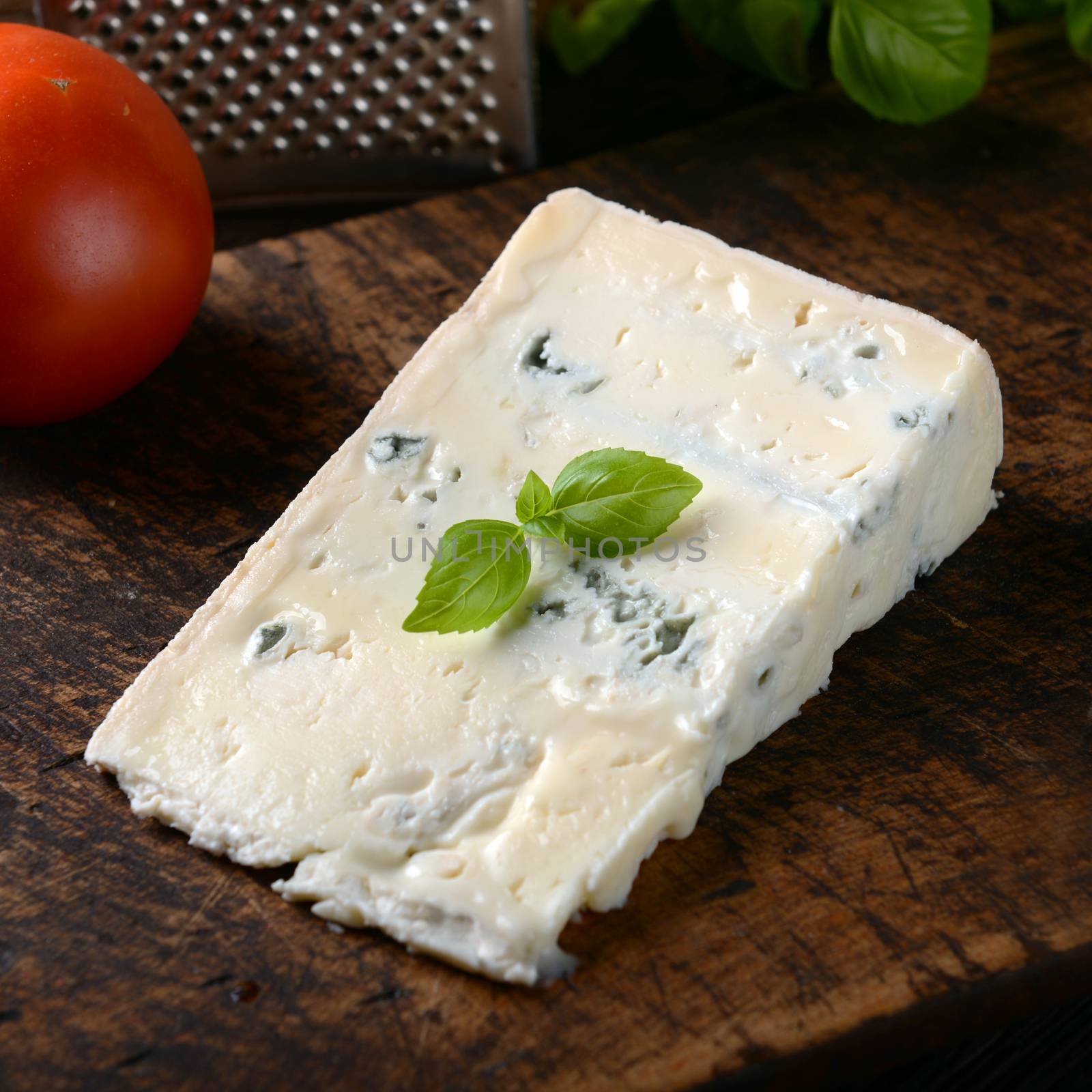 gorgonzola cheese on old wooden background