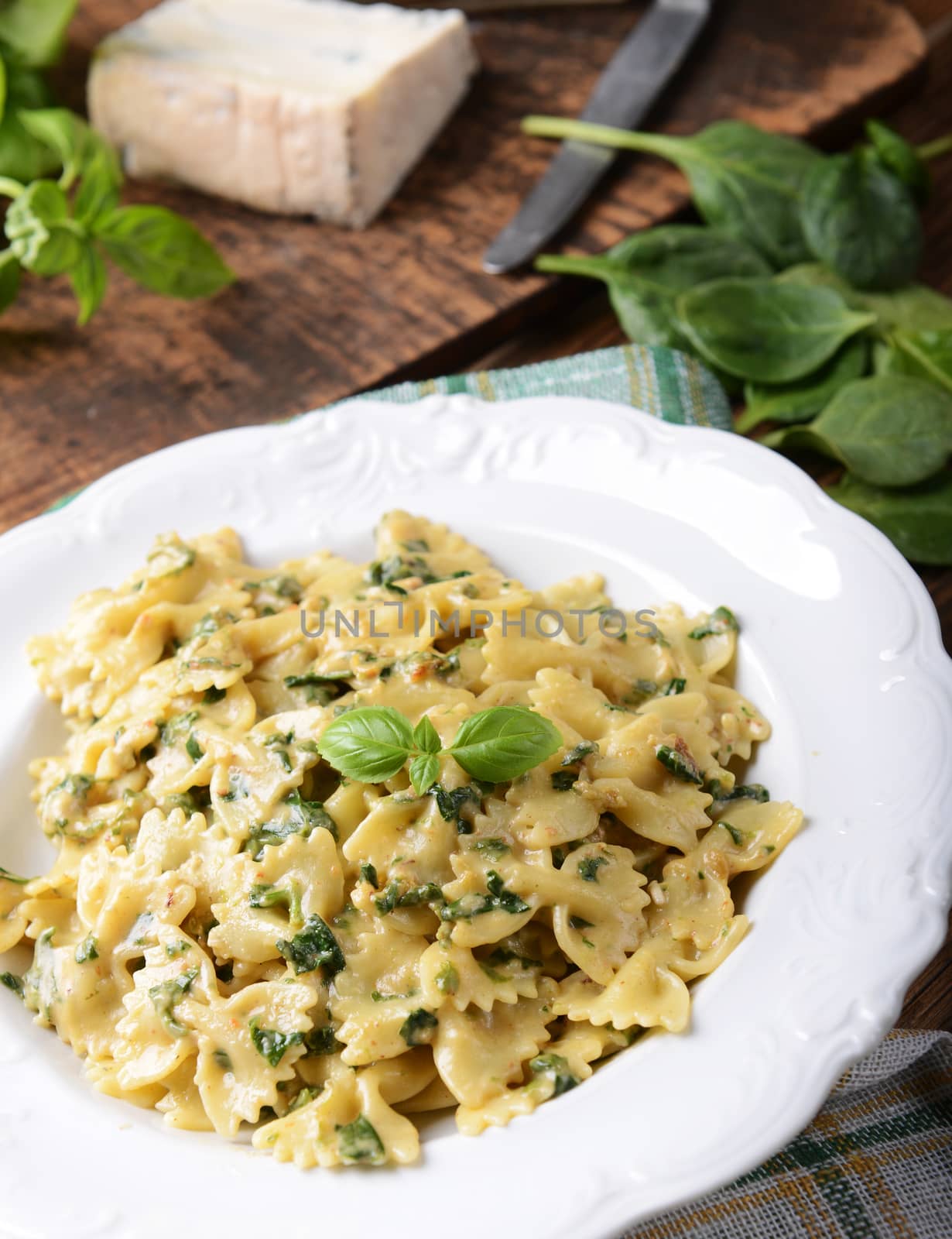Farfalle pasta with fresh spinach and gorgonzola cheese