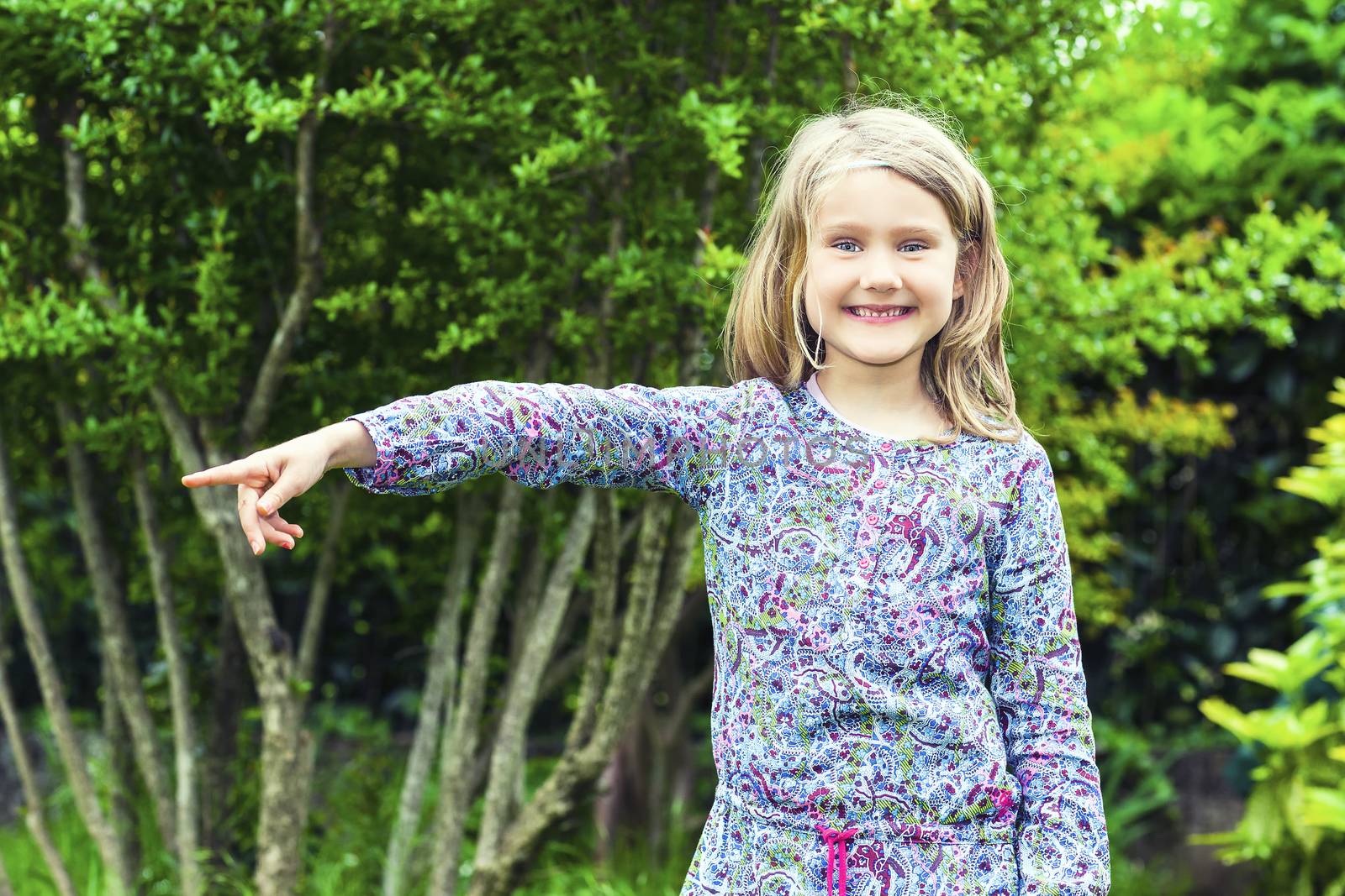 Little Girl in the Woods showing something