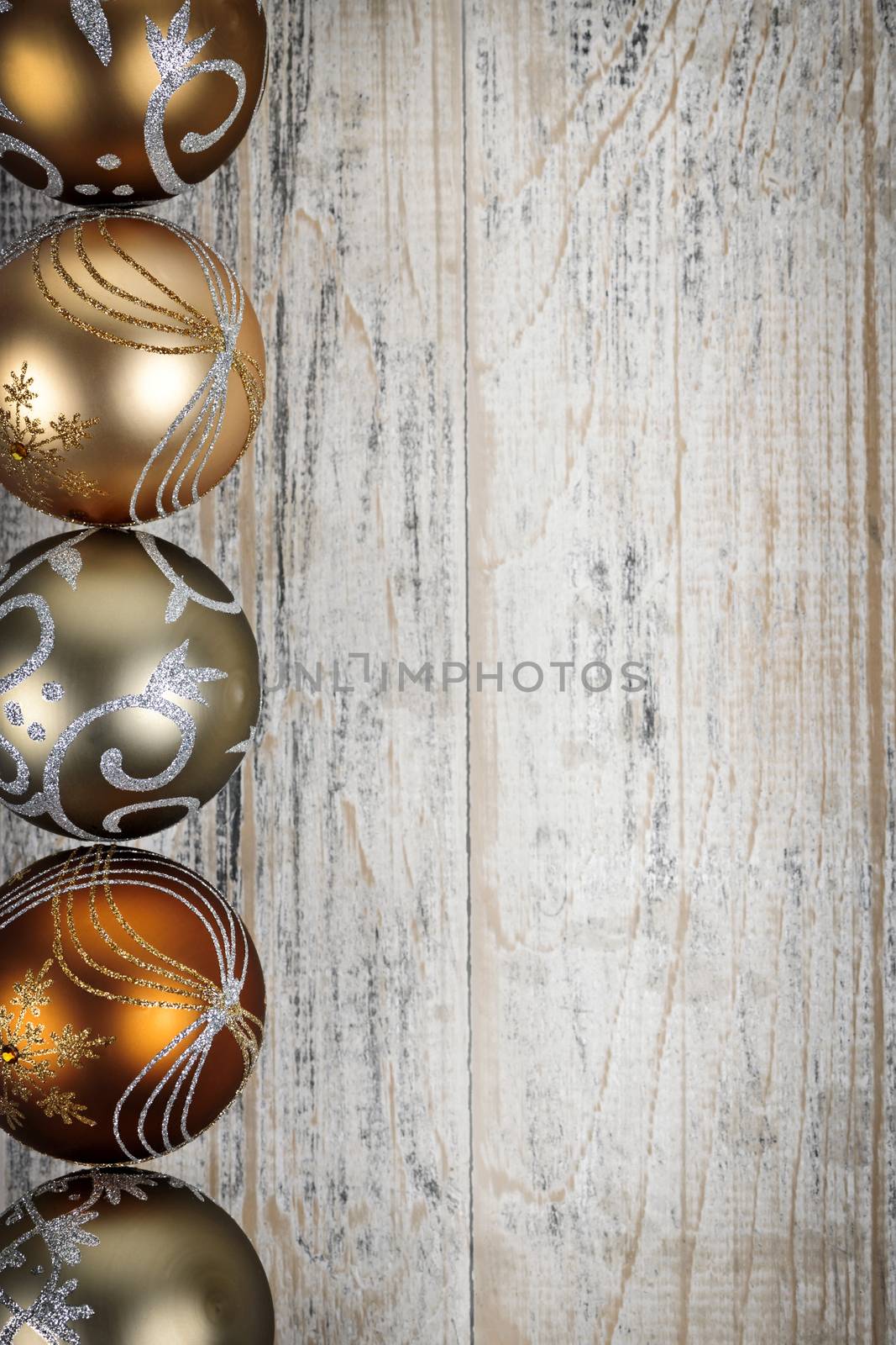 Golden Christmas ornaments border by elenathewise