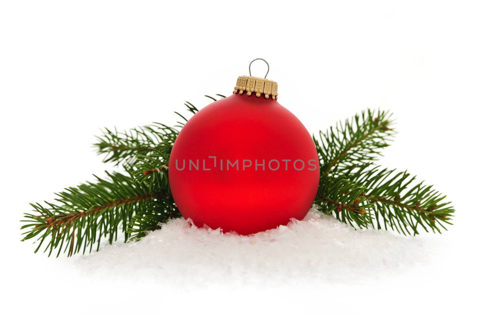 Red christmas ball with spruce tree branch isolated on white background