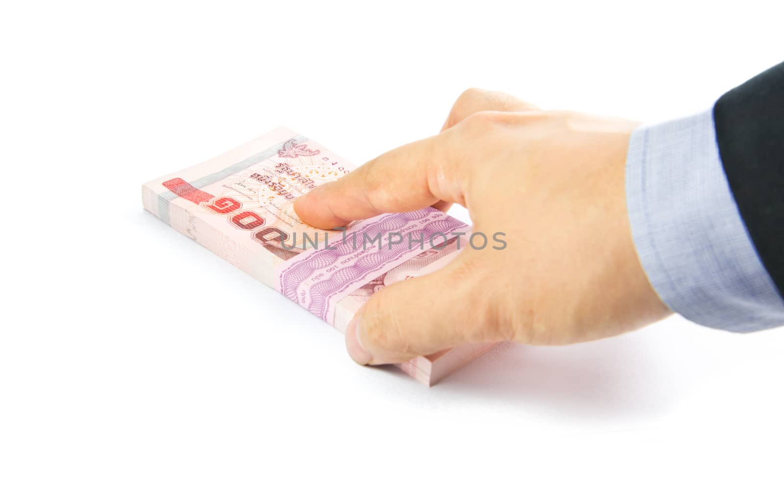 Hand holding a bulk of 100 baht Thailand banknote
