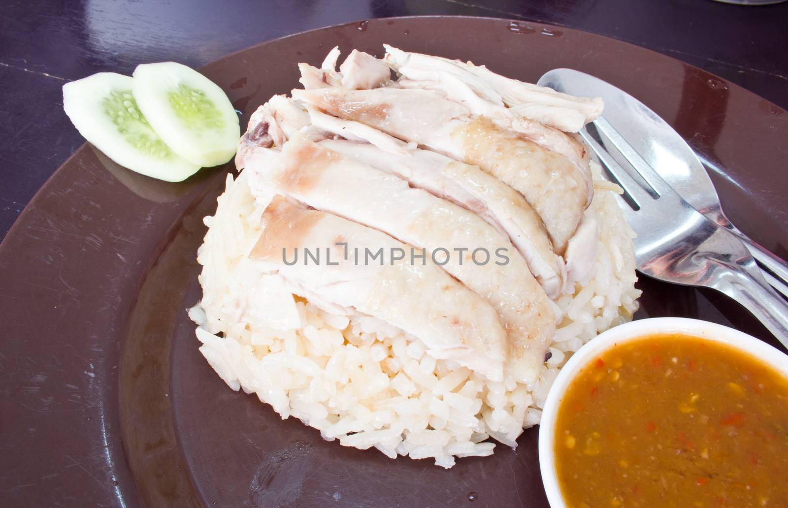 Asian style hainan chicken rice closeup  by tisskananat