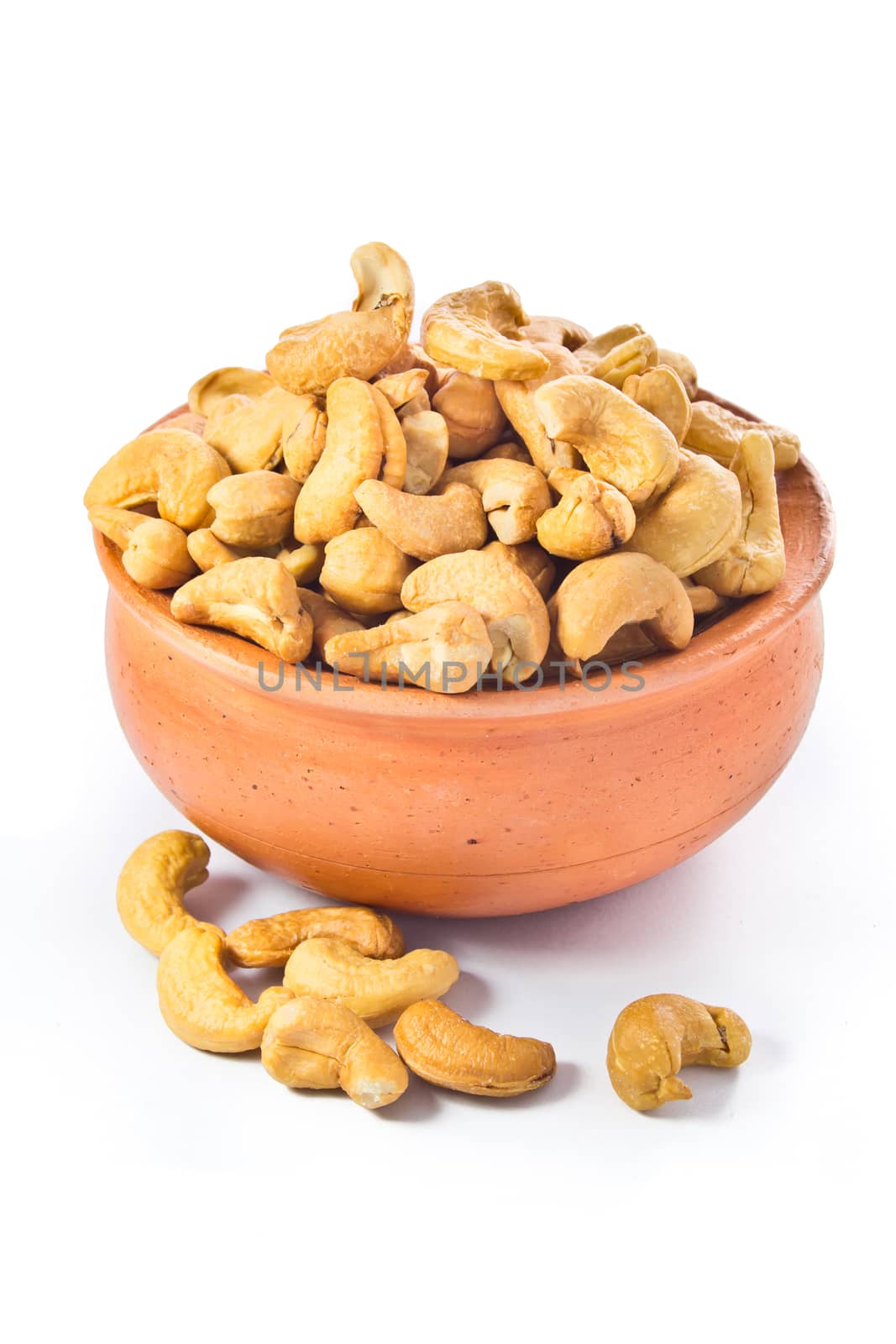 cashews nut in bowl on white background  by tisskananat