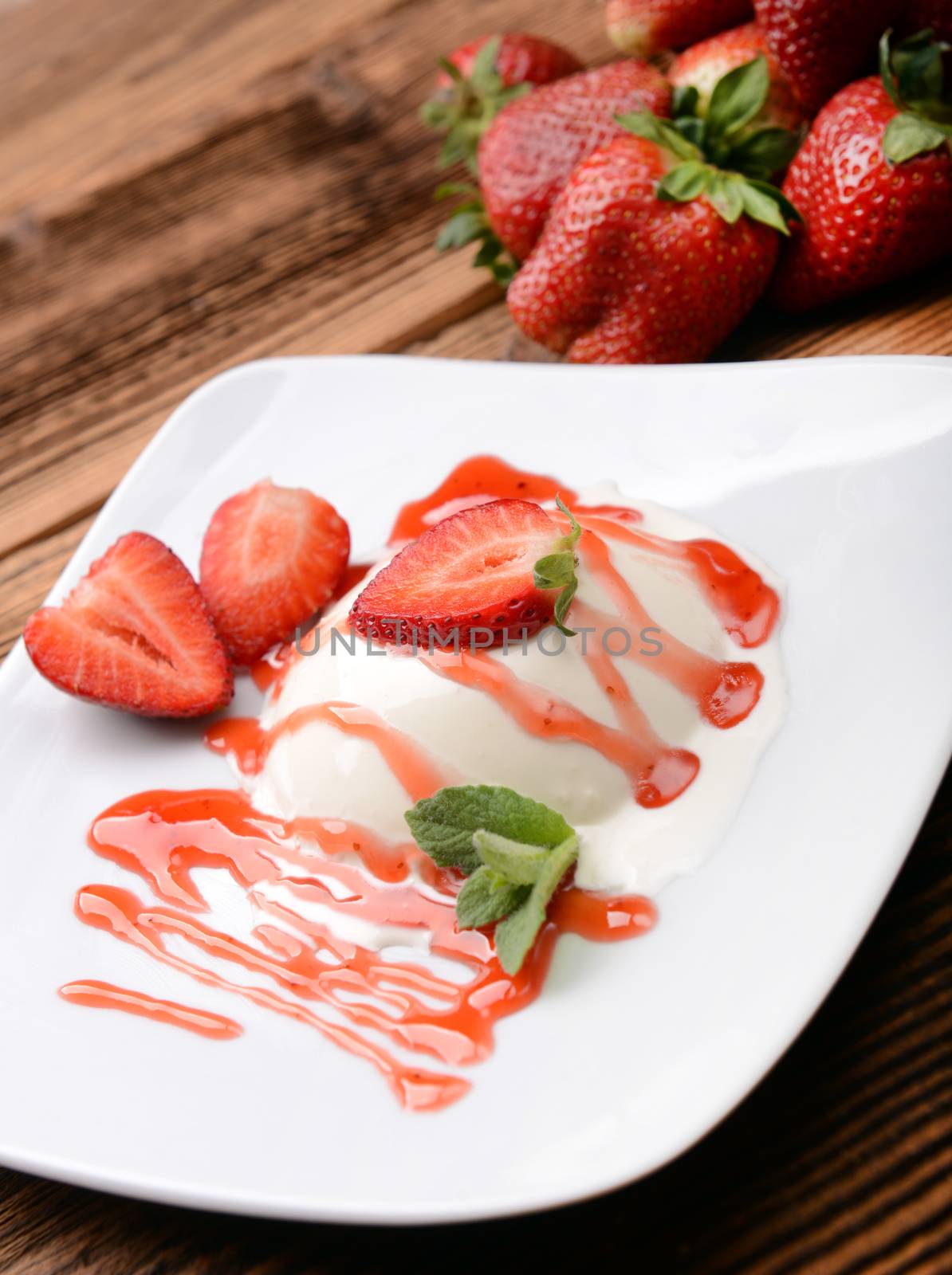 Italian dessert panna cotta with fresh strawberries