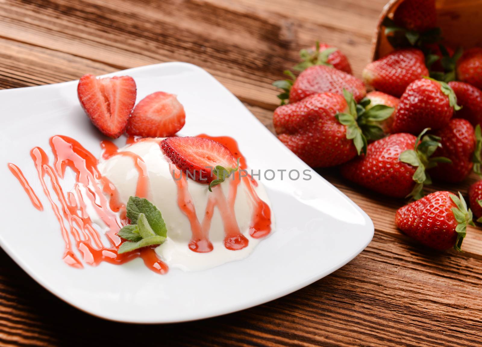 Italian dessert panna cotta with fresh strawberries