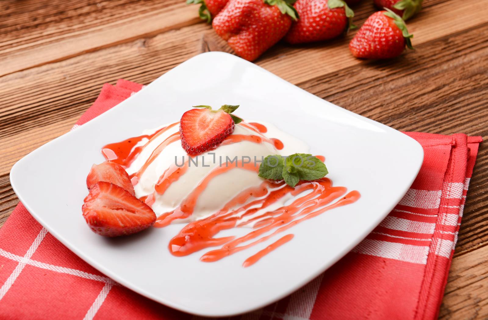 Italian dessert panna cotta with fresh strawberries