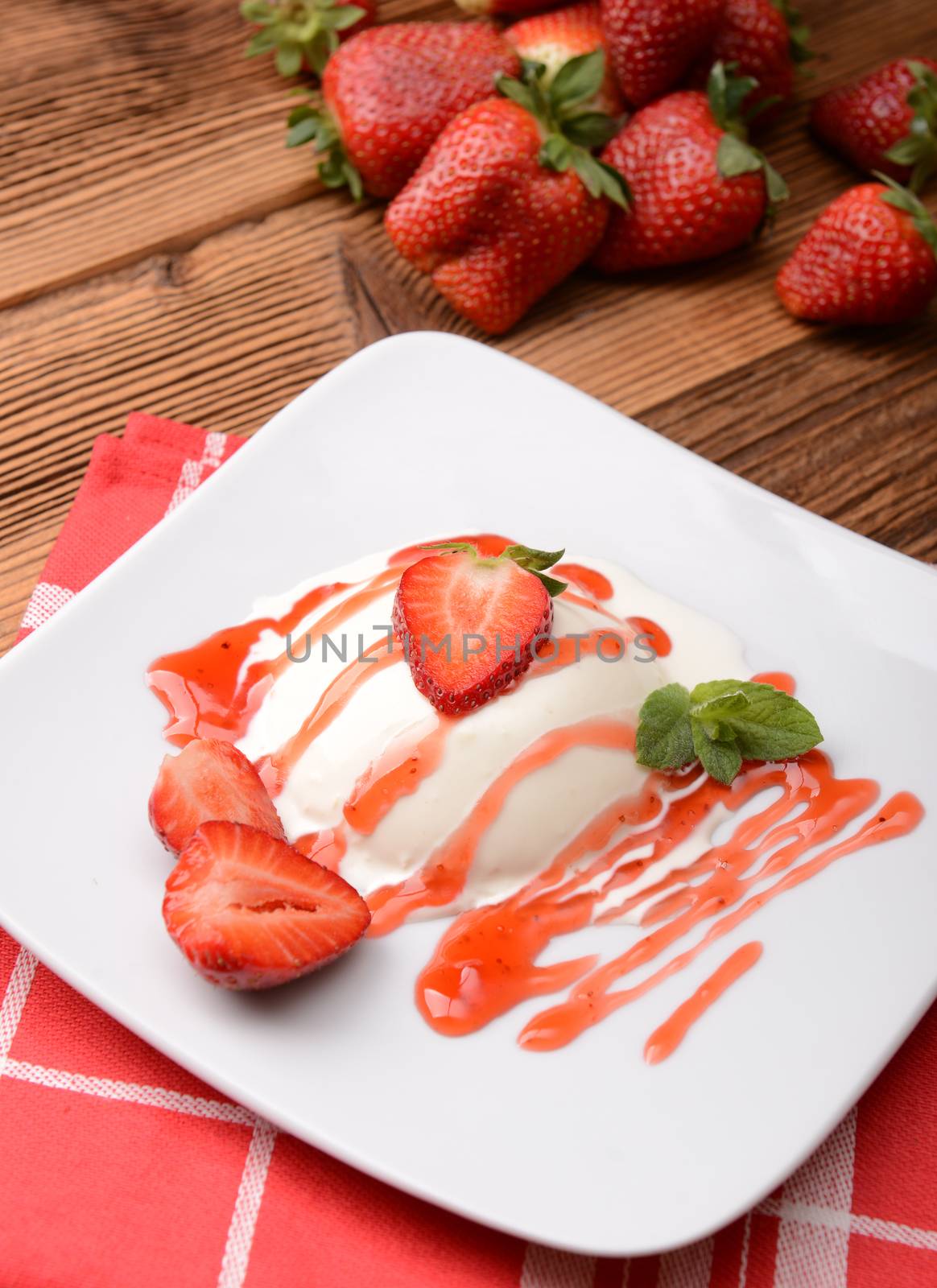 Italian dessert panna cotta with fresh strawberries