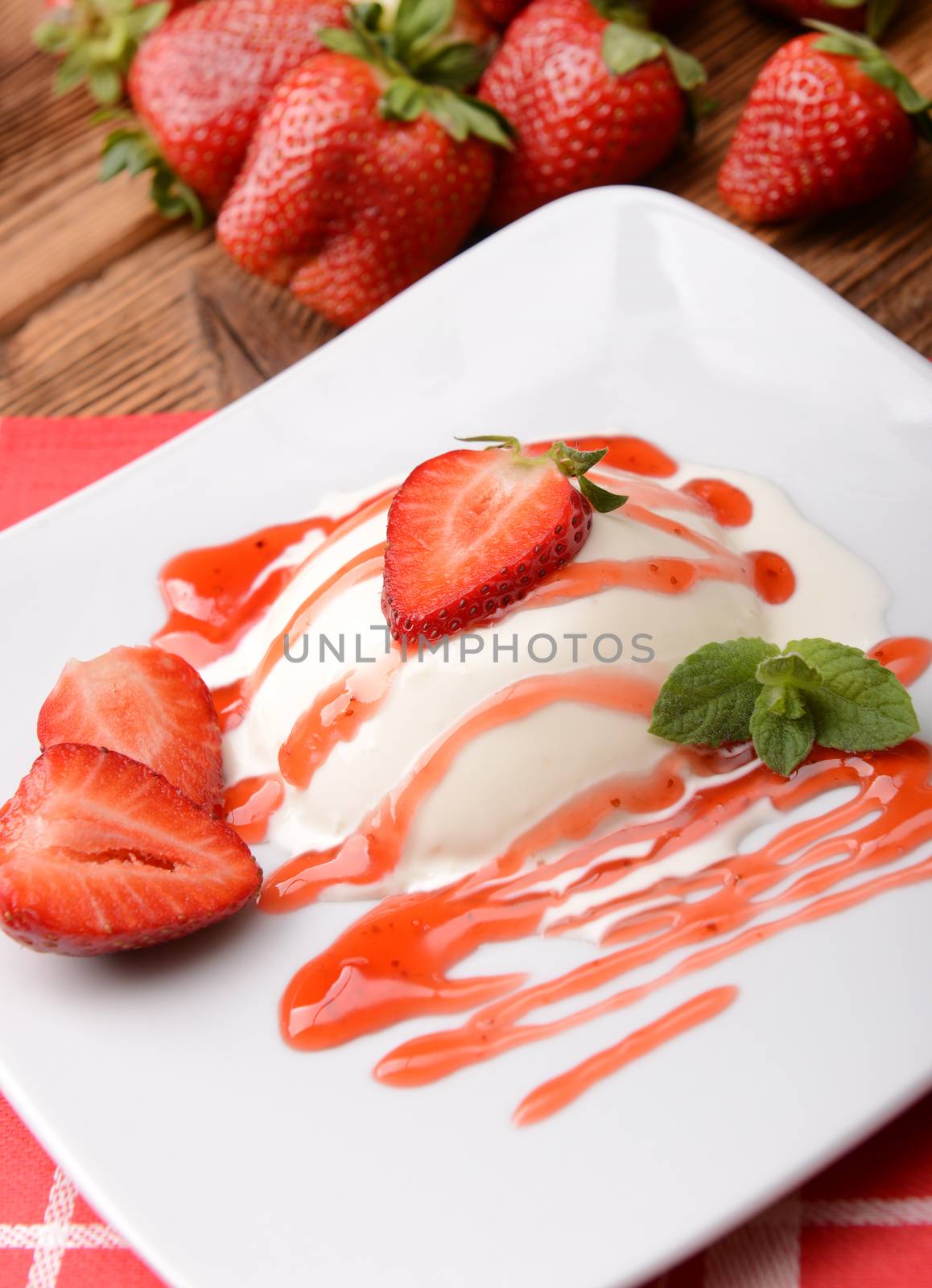 Italian dessert panna cotta with fresh strawberries