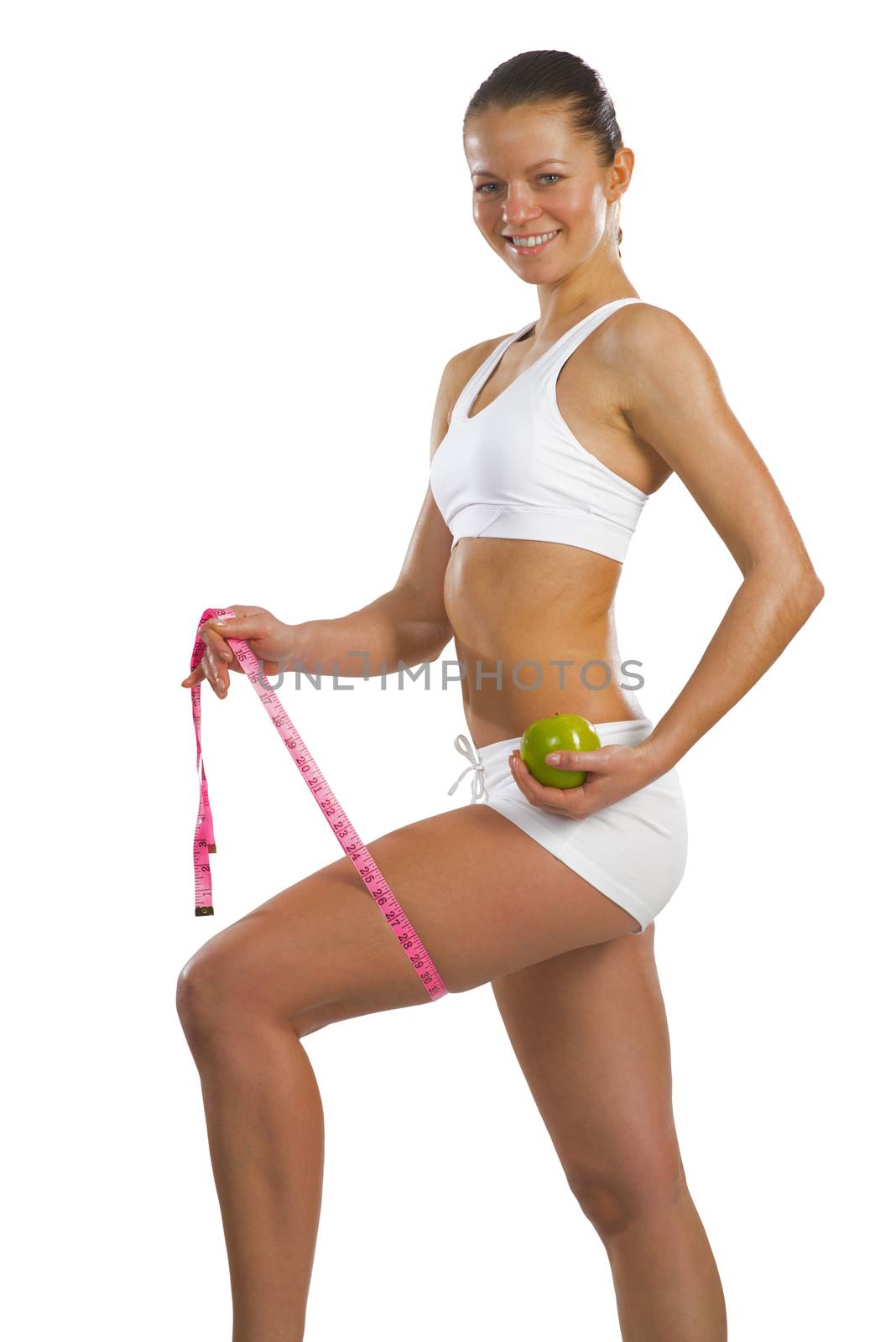 image of a young attractive woman with measuring tape and green apple