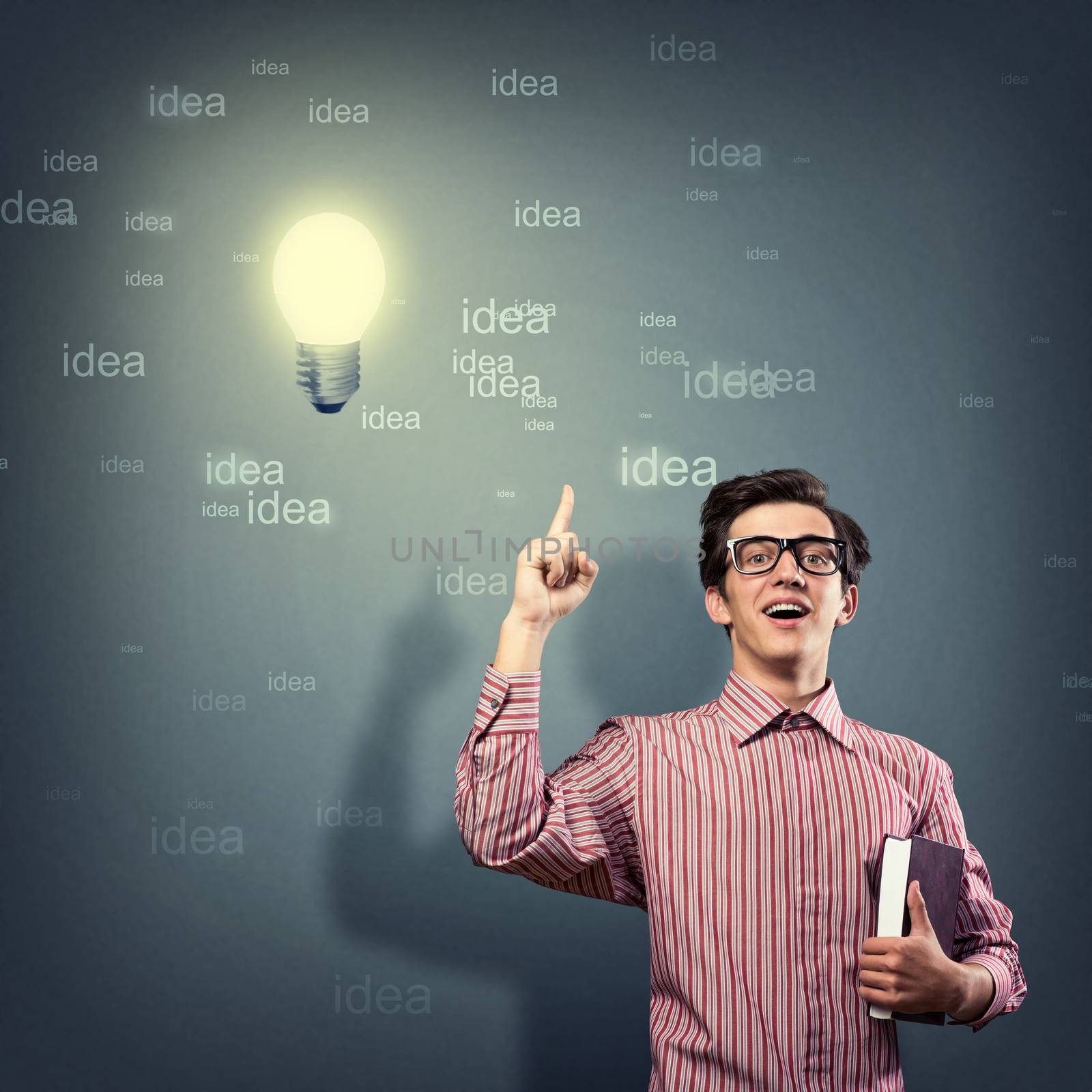 young man holding a book in front of him, raised his hand, the idea