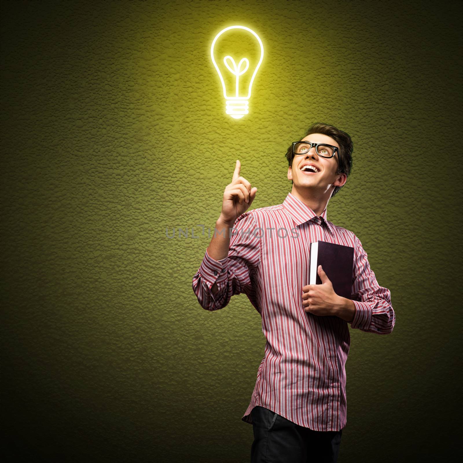 young man holding a book in front of him, raised his hand, the idea