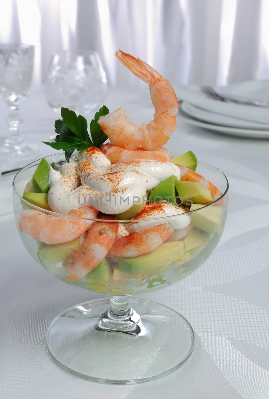 Shrimp with avocado yogurt and red pepper in a glass