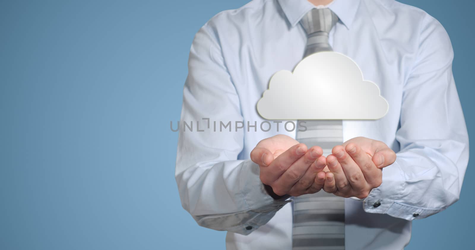 Businessman holding cloud computer network by alistaircotton