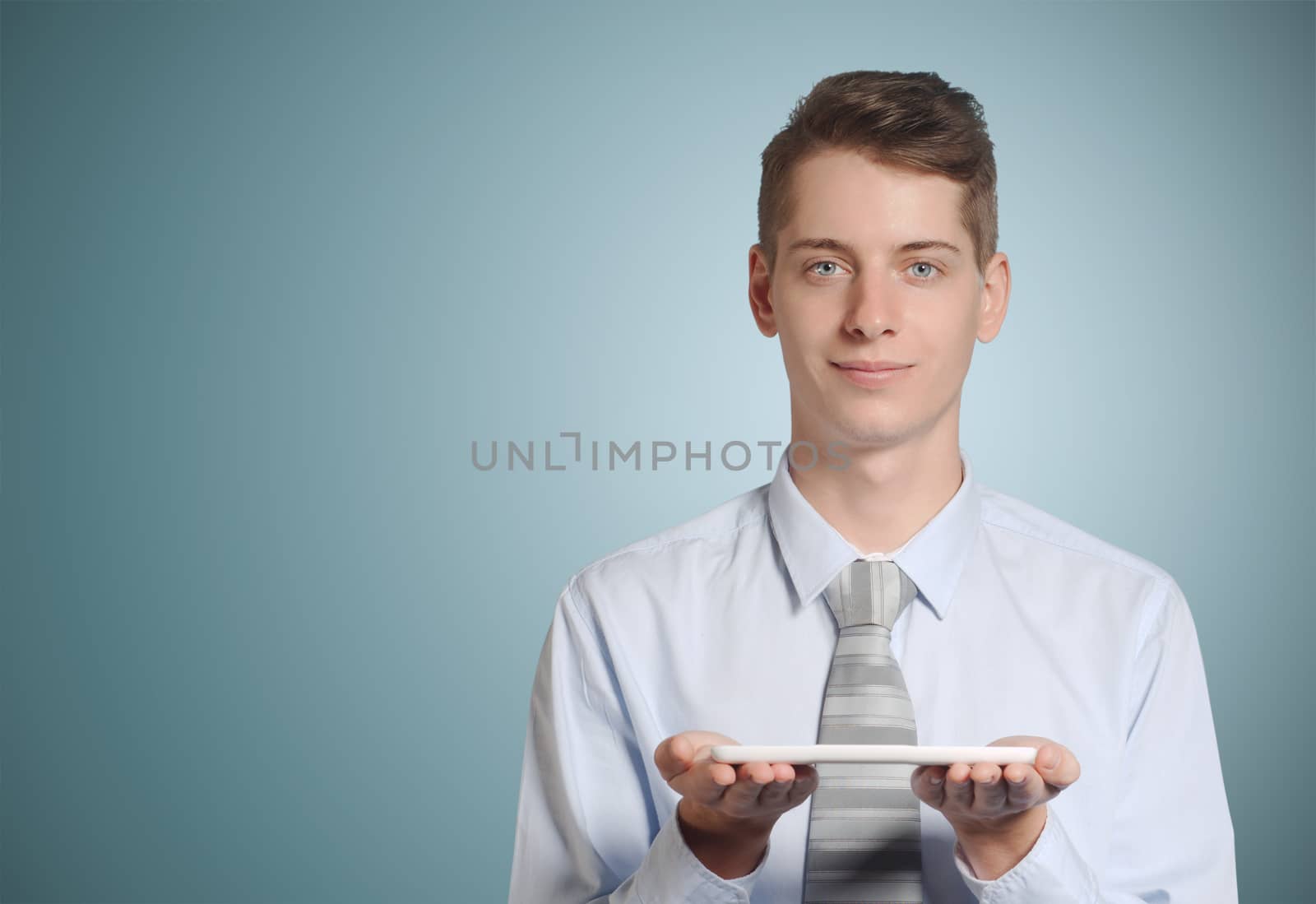 Businessman holding tablet computer by alistaircotton