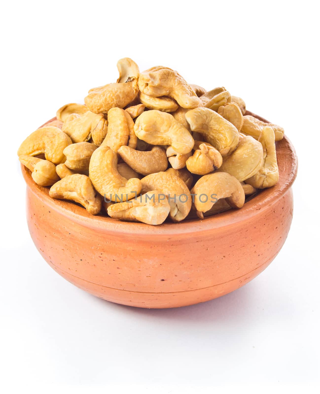 cashews nut in bowl on white background  by tisskananat