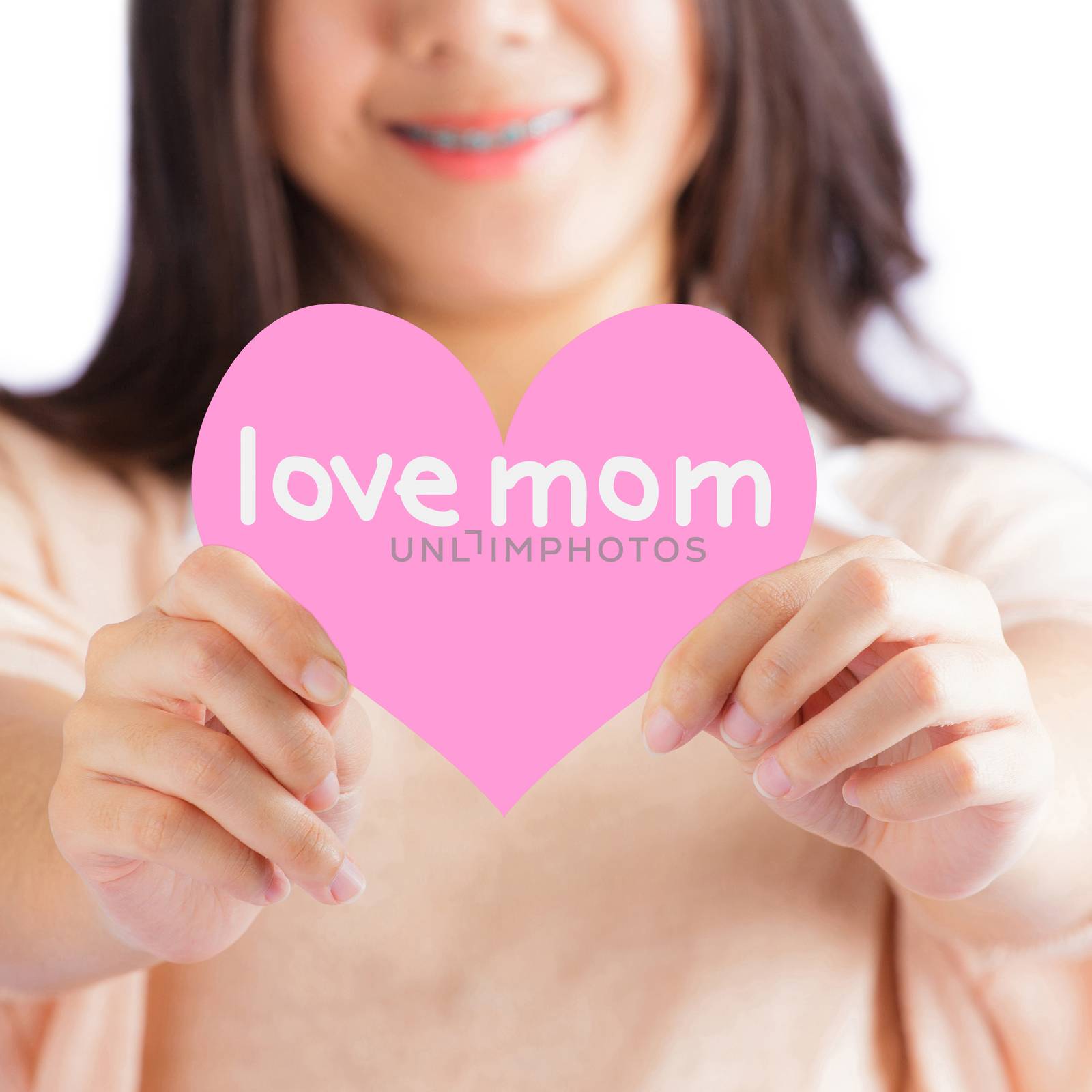 Woman holding pink heart with love mom