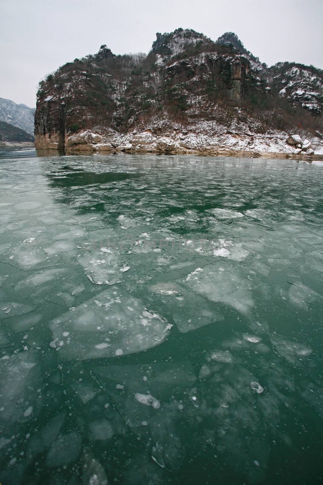 winter landscape with lake covered with ice frozen, south korea