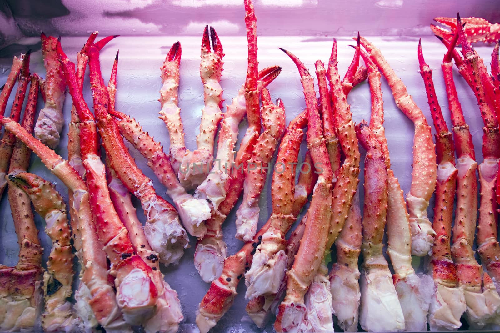 pile of cribs and spider-crabs in a fish and seafood market by think4photop