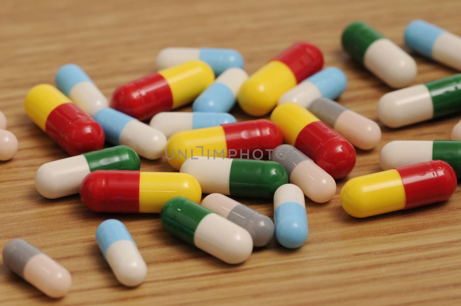 Some capsules and pills on white background