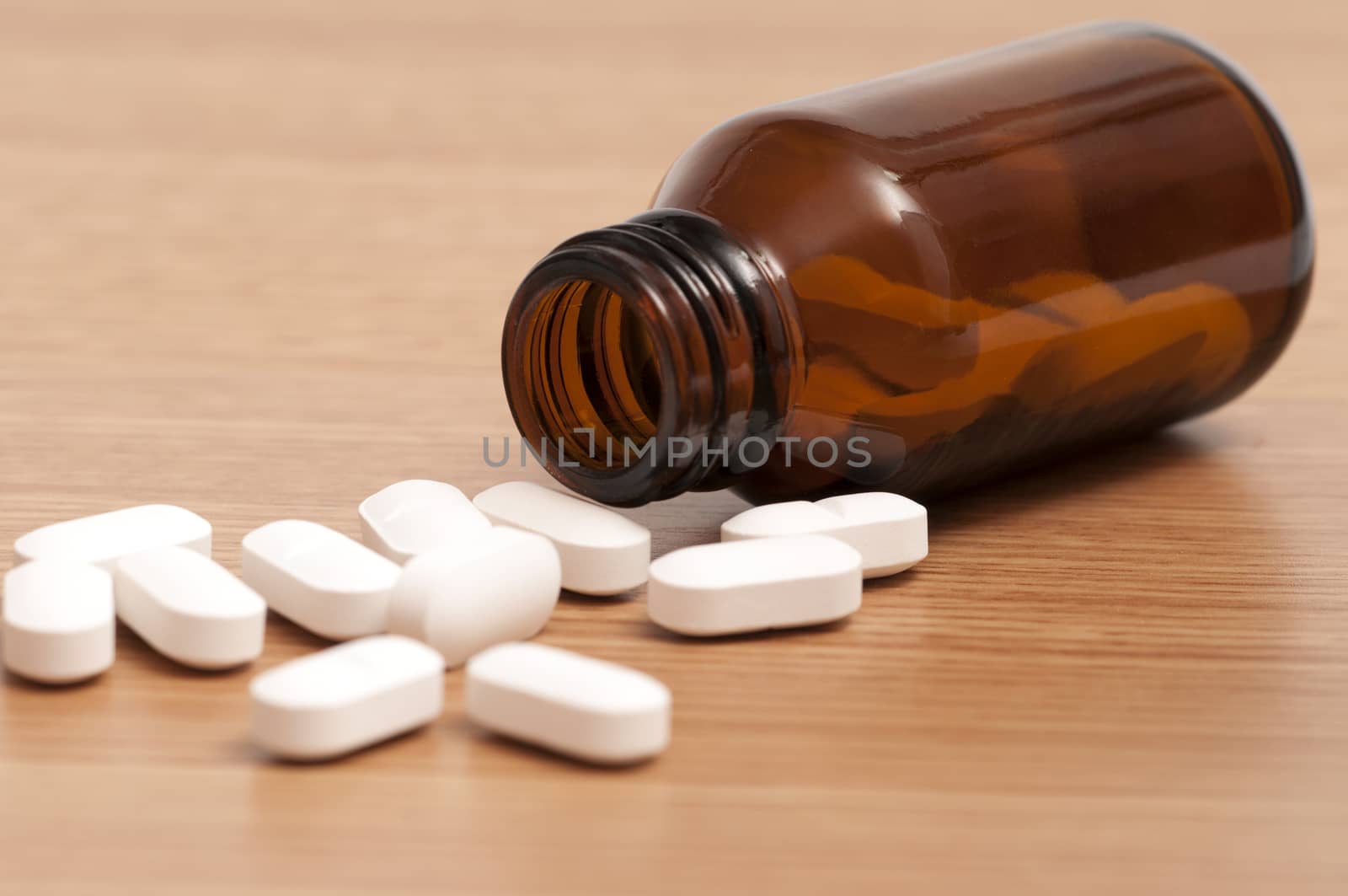 Capsules and Pills in a bottle by rodrigobellizzi