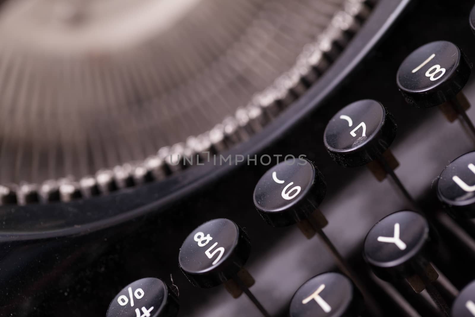 Close up photo of antique typewriter keys, shallow focus, natural colors