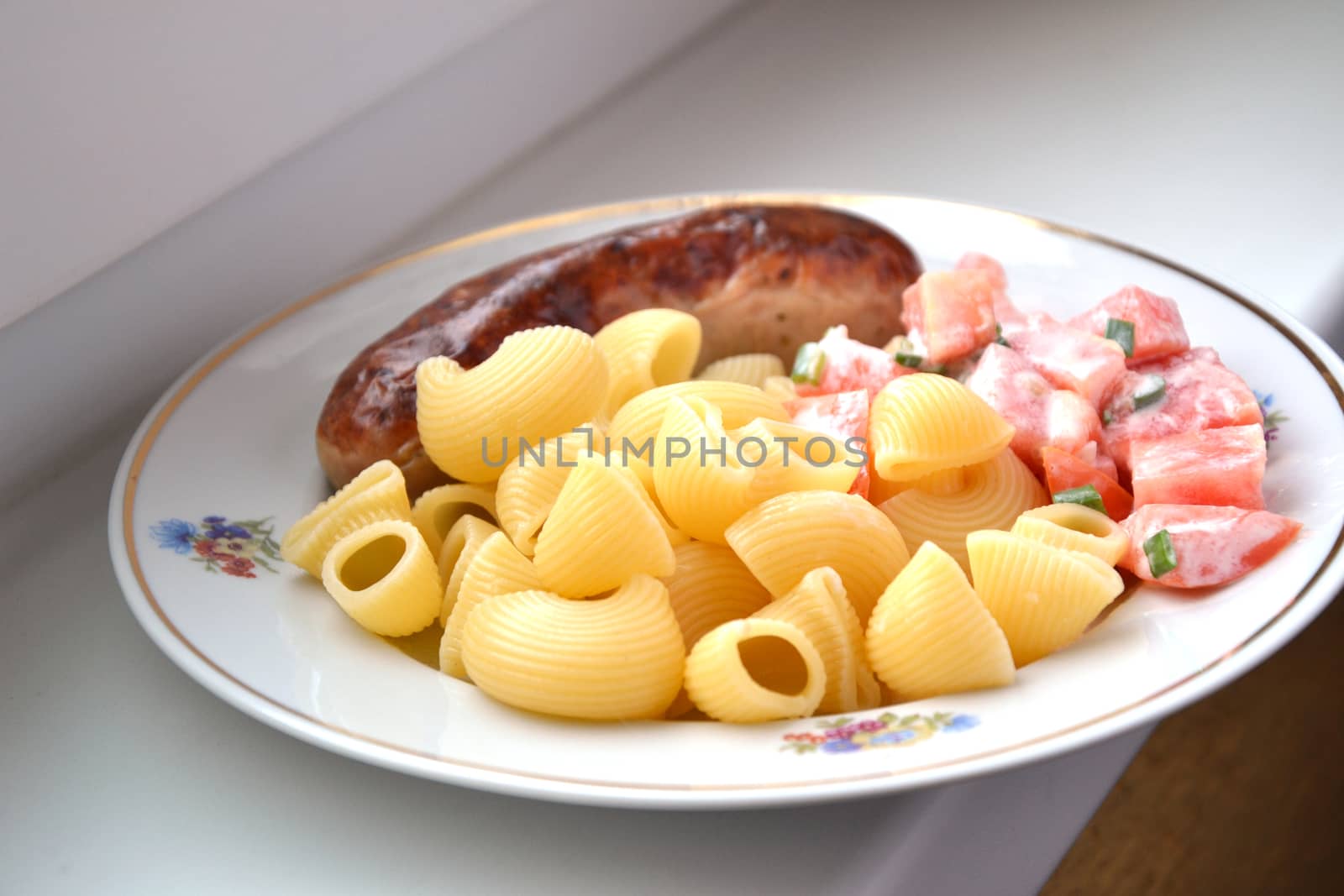 Dish with meat, pasta and tomato by ruv86