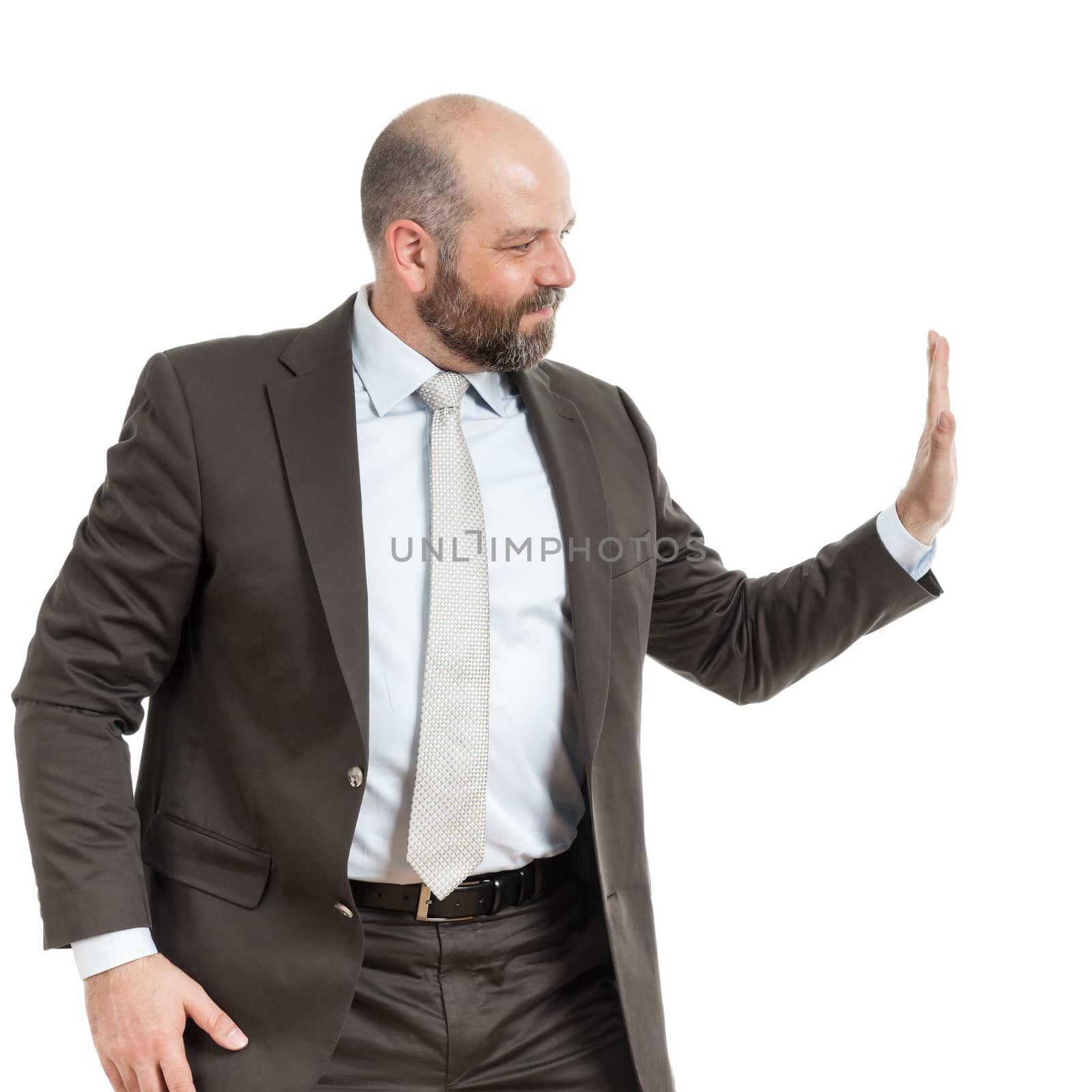 An image of a handsome business man pushing something