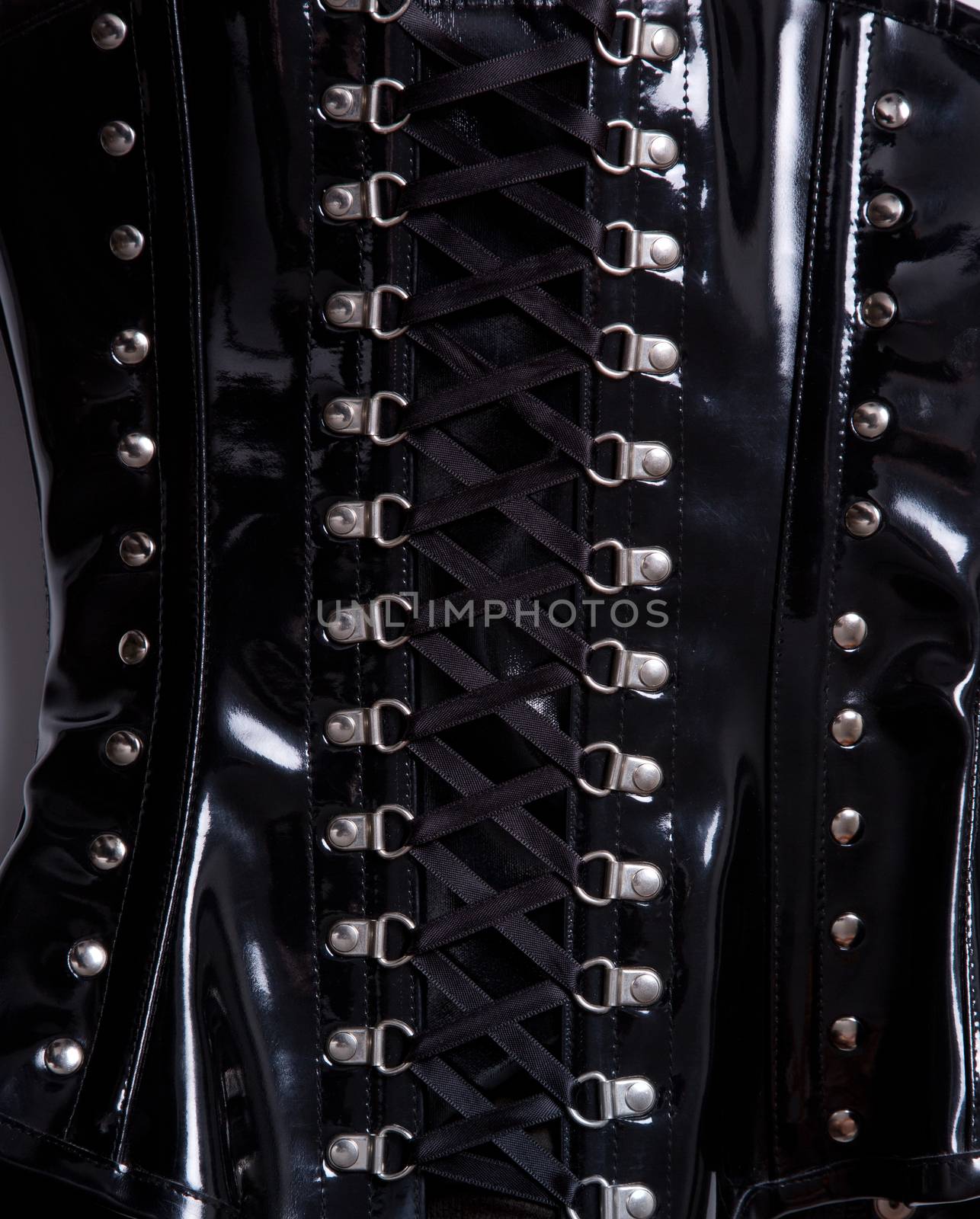 Close-up shot of professional waist training black leather corset 