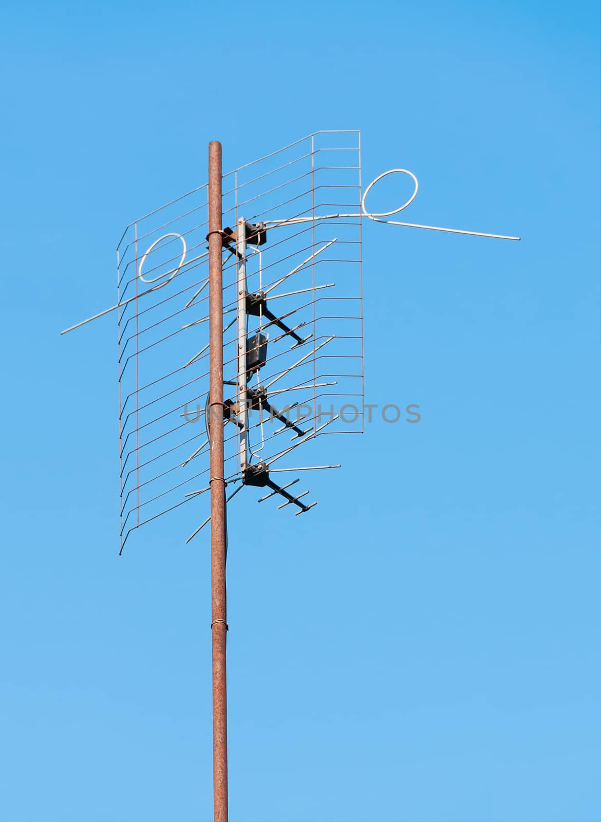 Old TV antenna on a background of blue sky