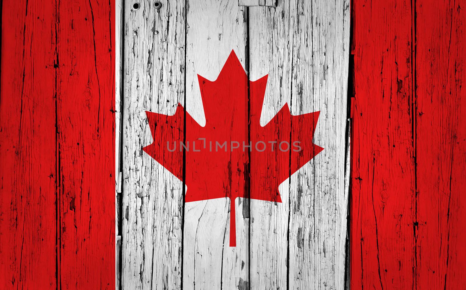 Canada grunge wood background with Canadian flag painted on aged wooden wall.