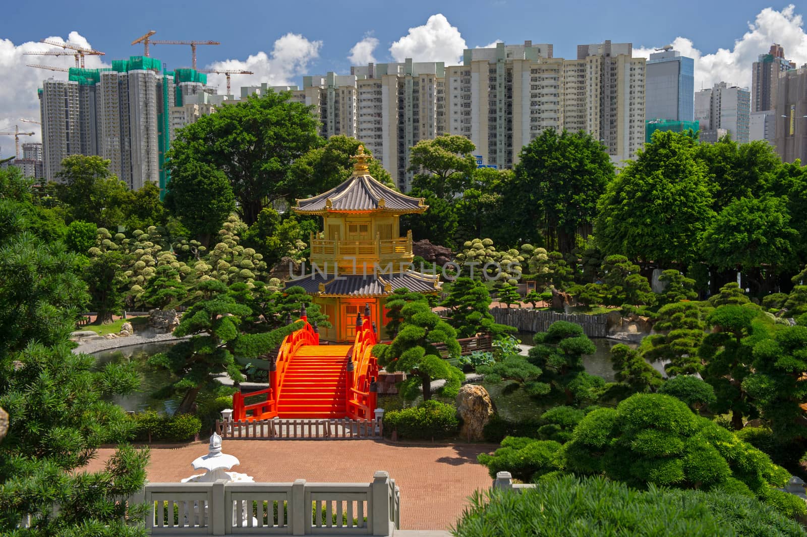 Arch Bridge and Pavilion in Nan Lian Garden, Hong Kong. by think4photop