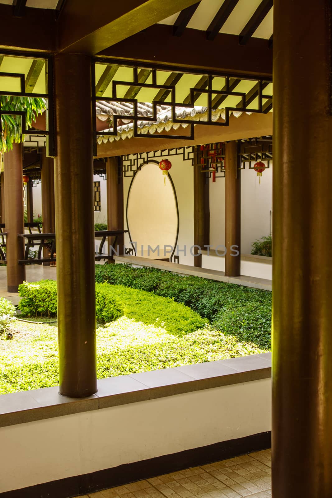 trypical style of chinese gate between garden and house