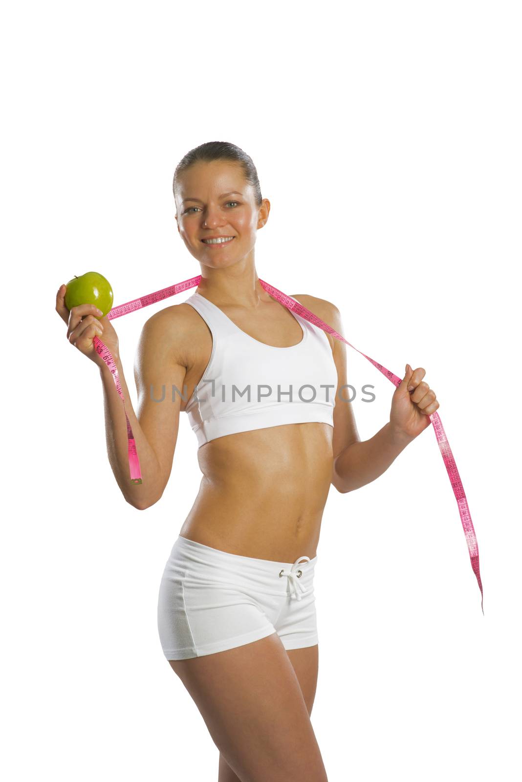 image of a young attractive woman with measuring tape and green apple