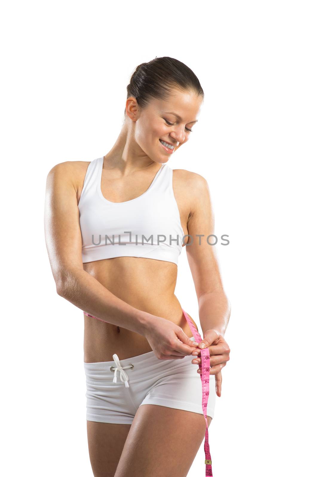 athletic woman measuring waist by adam121