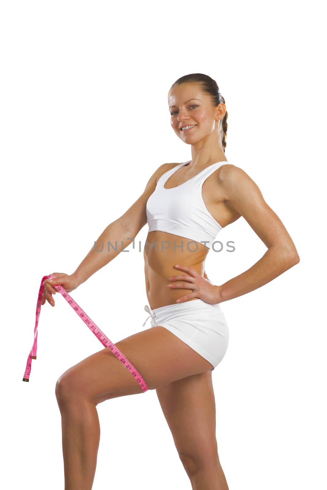 image of a young athletic woman measuring thigh