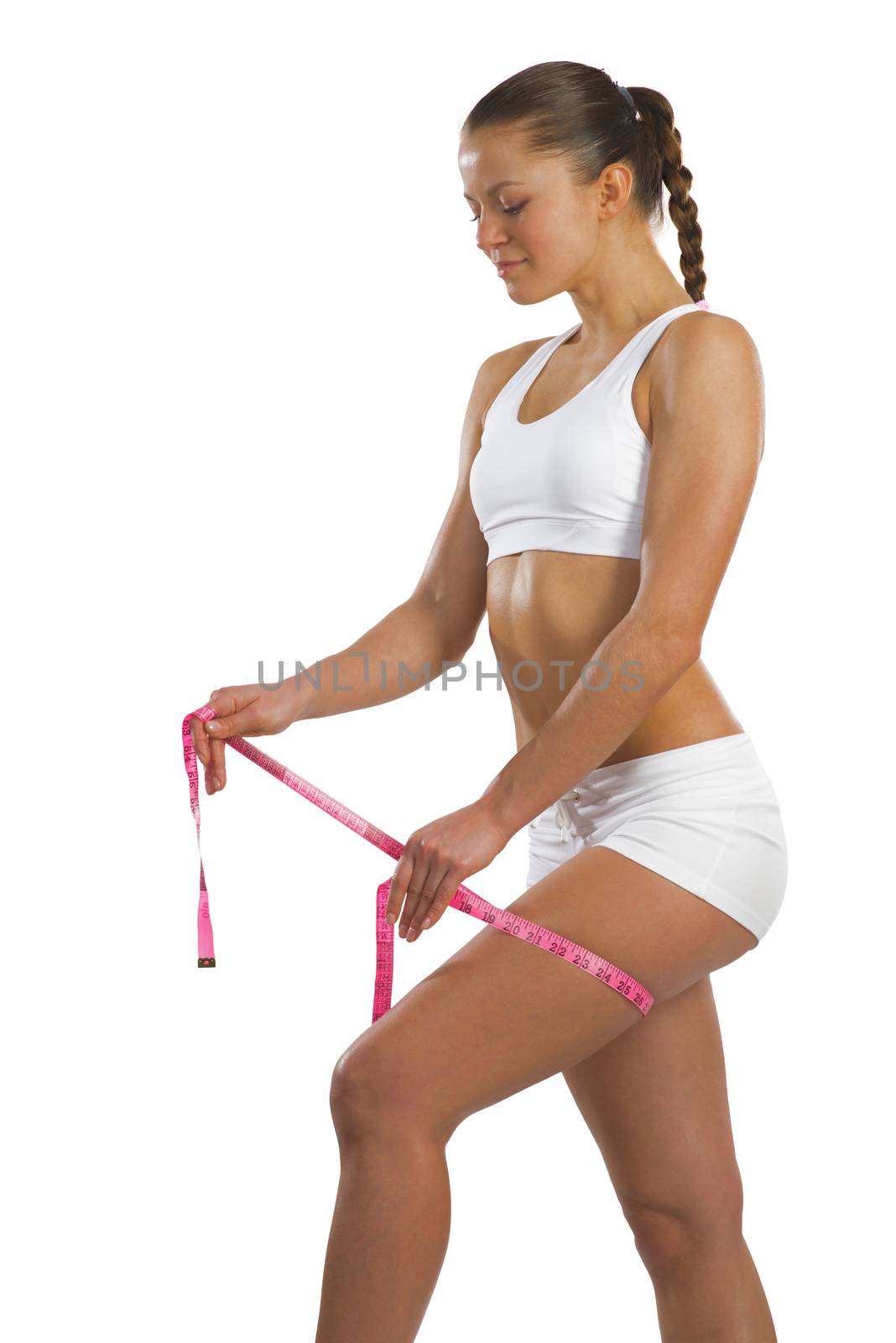 image of a young athletic woman measuring thigh