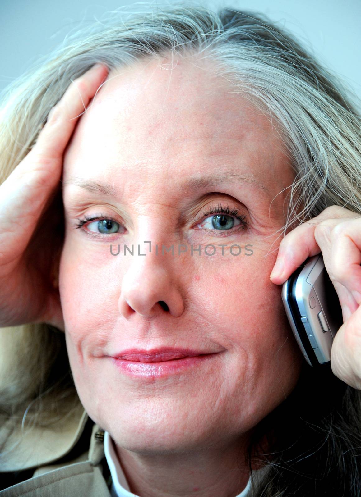 Mature female blond beauty expressions outside.