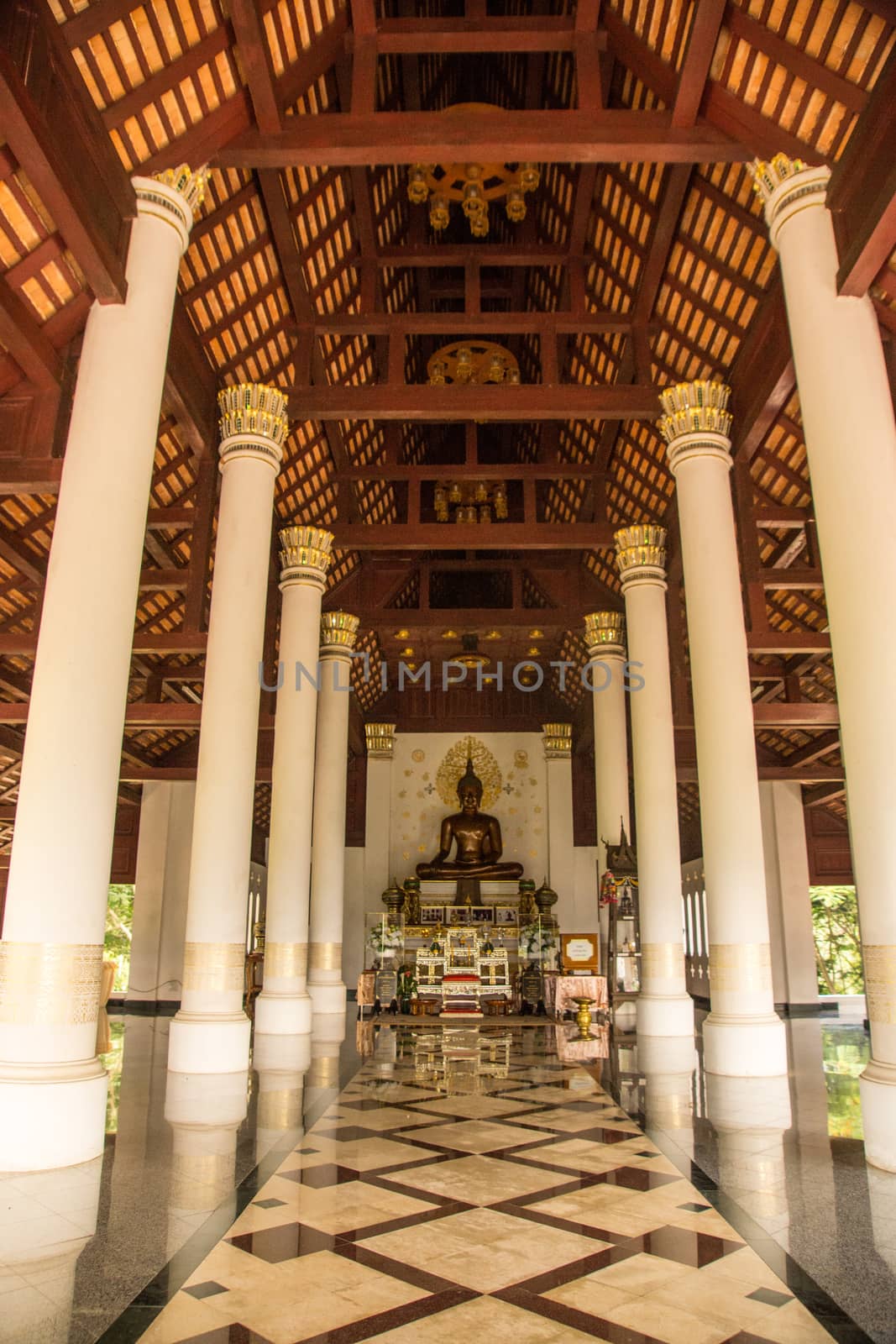 bronz metal Buddha image in temple hall,Chiangrai,Thailand