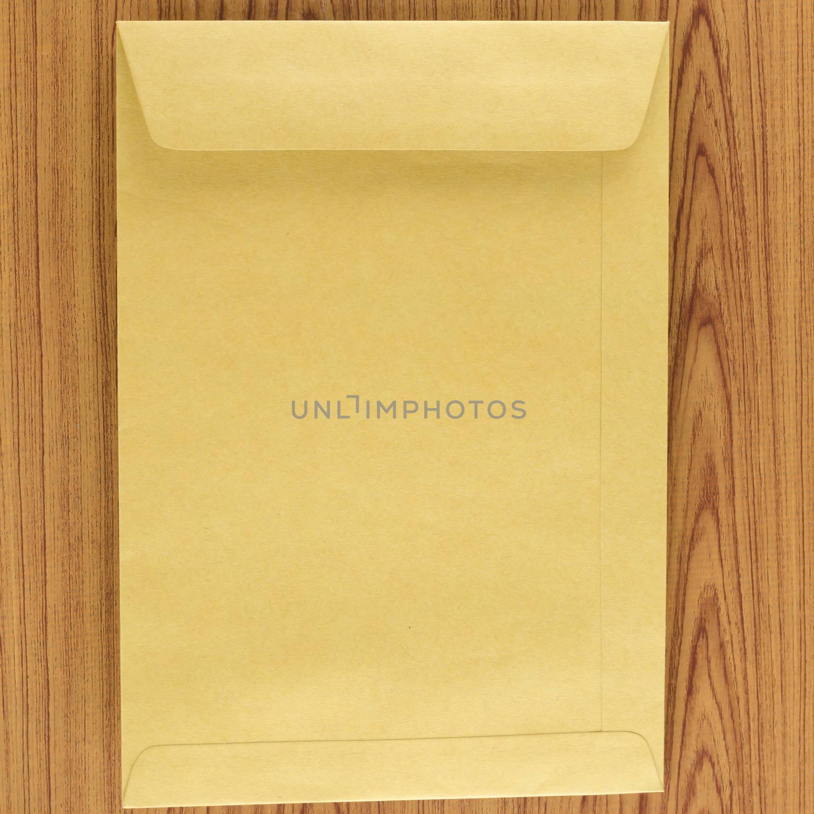 brown envelope on wood table background