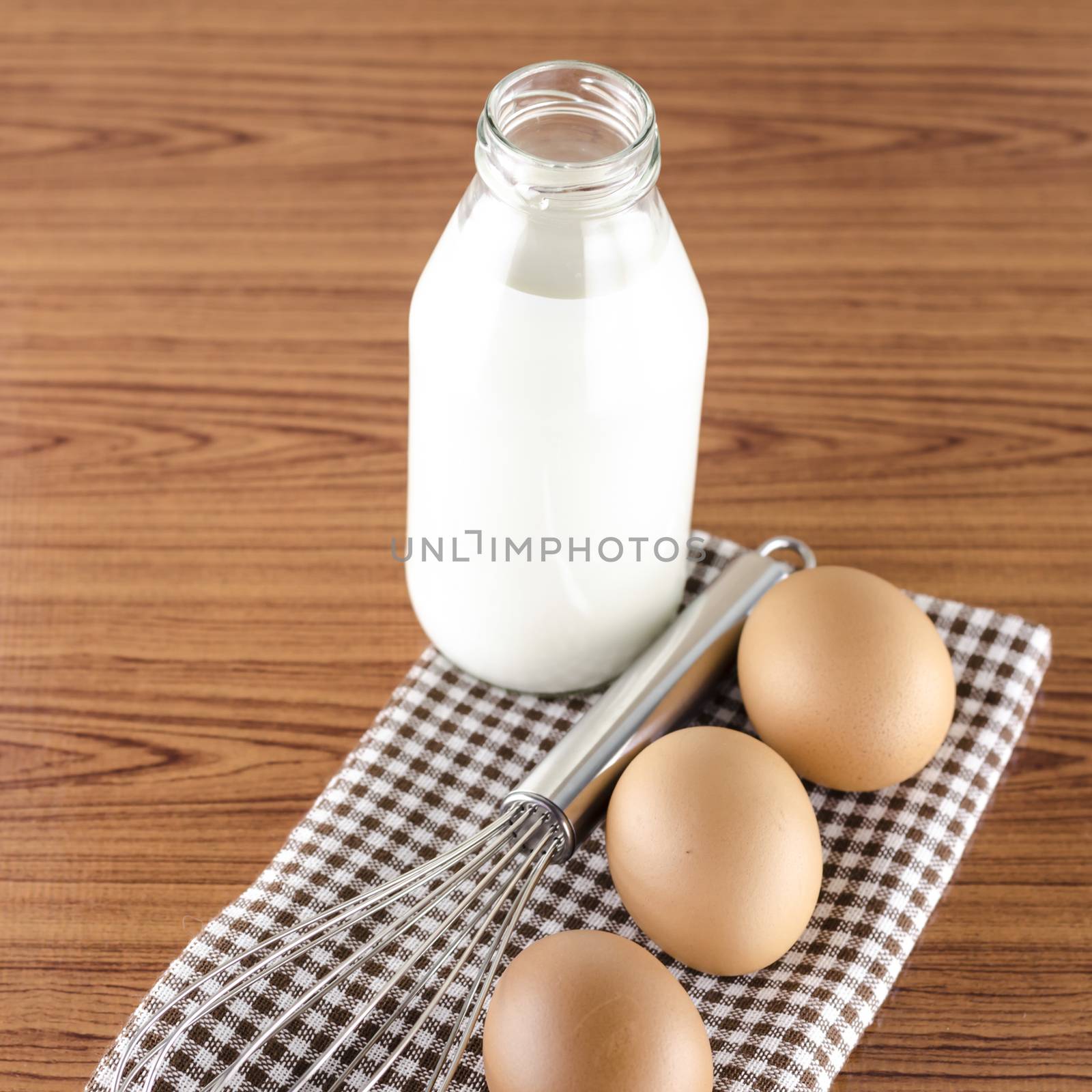 whisk egg and milk concept tools for baking beakery