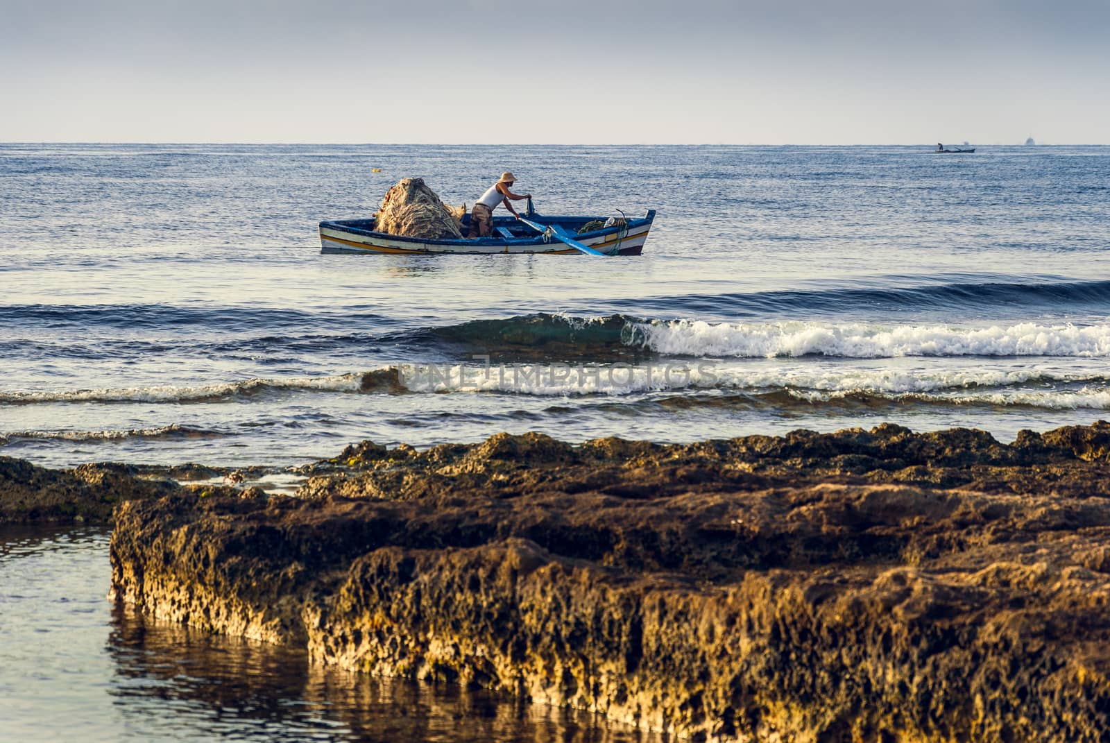 Fisherman in a Boat in the Morning