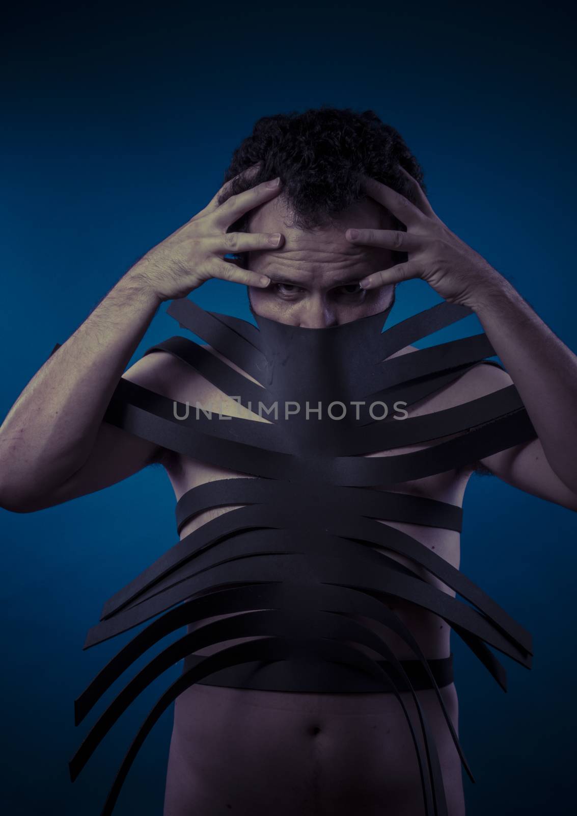 Bdsm, man covered with black strips, shibari concept art