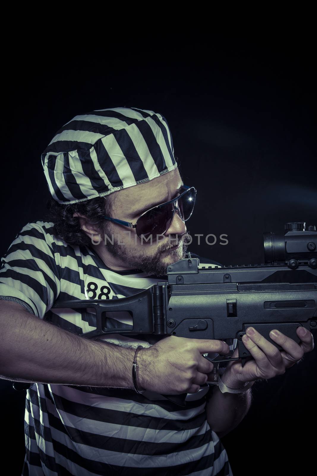 riot, prisoner in a prison with a machine gun