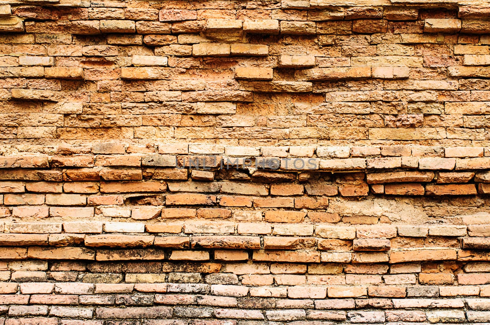 Old brick wall. by NuwatPhoto