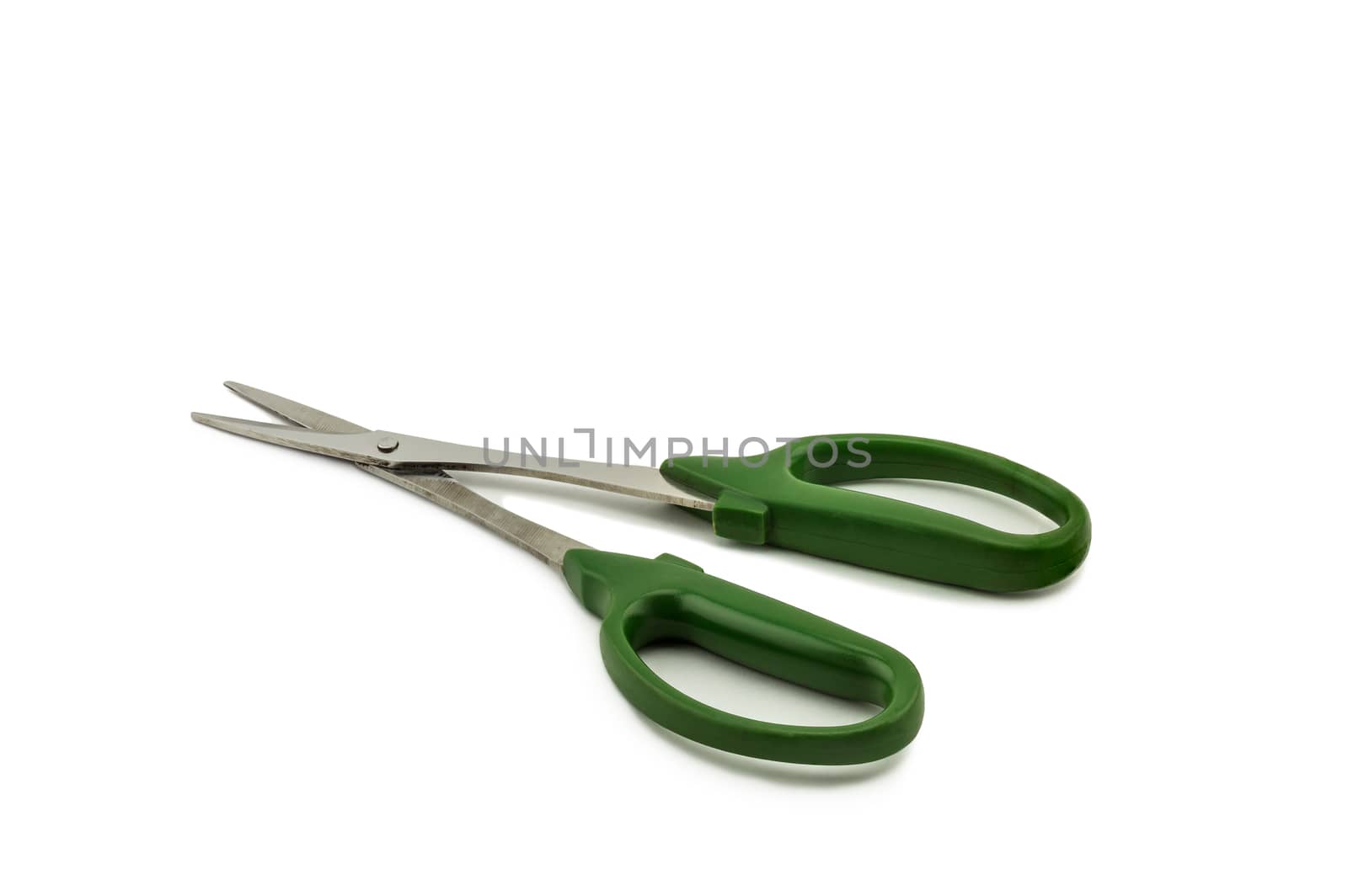 Green scissors isolated on white background