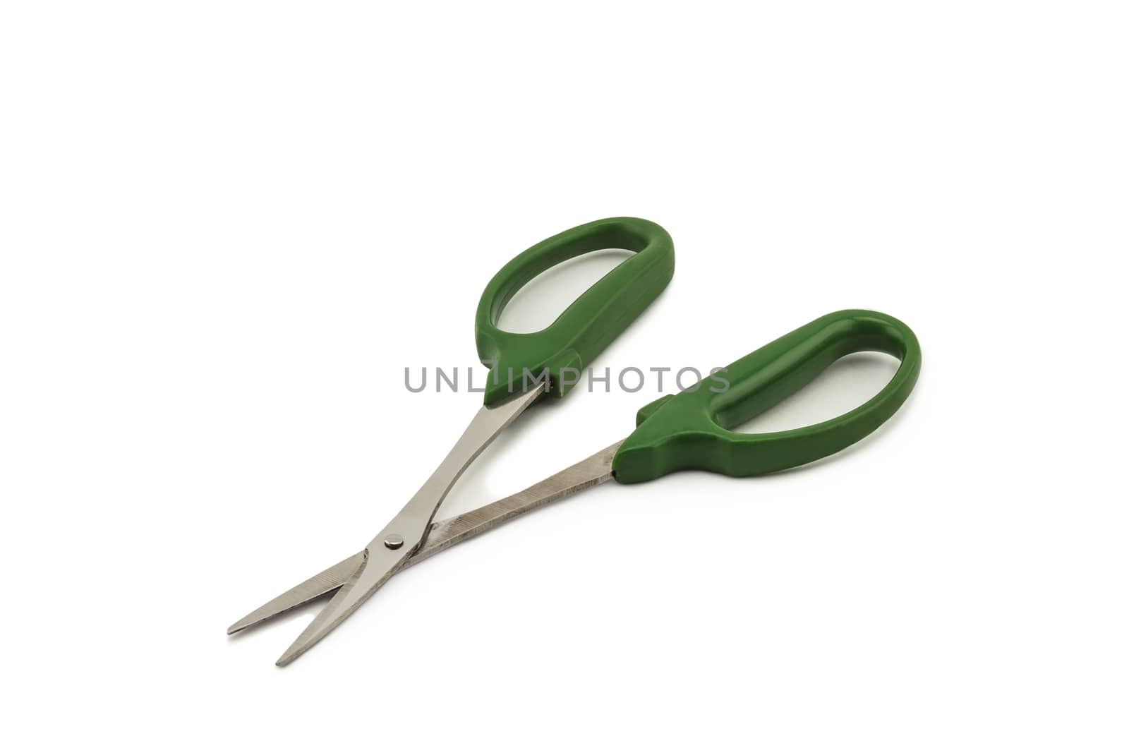 Green scissors on white background